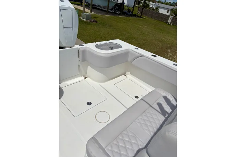 Slide: The Image of 2024 SeaHunter 31 Tournament boat interior with cushioned seating and storage compartments. - 25