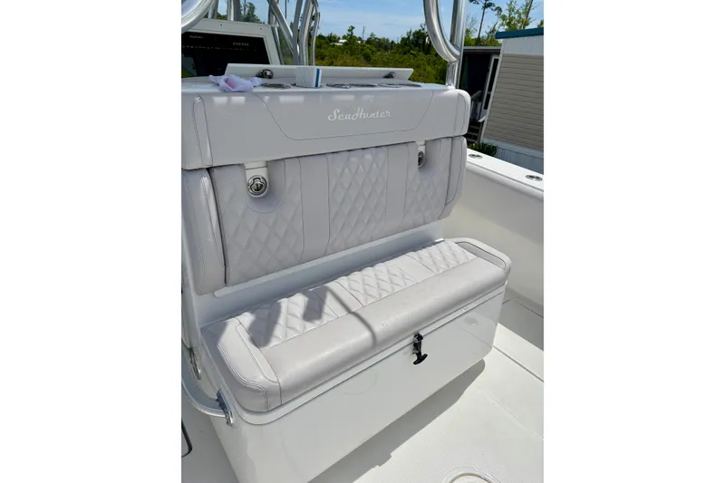 Slide: The Image of 2024 SeaHunter 31 Tournament boat seat with quilted upholstery and storage compartment. - 26