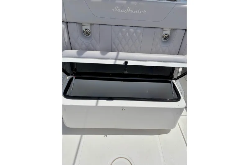 Slide: The Image of 2024 SeaHunter 31 Tournament boat with open storage compartment, showcasing sleek design and functionality. - 27