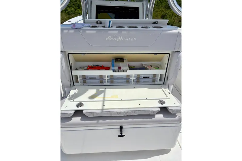 Slide: The Image of 2024 SeaHunter 31 Tournament boat with open storage compartment, showcasing organized fishing gear. - 28