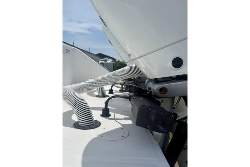 Slide: The Image of 2024 SeaHunter 31 Tournament boat engine area with hoses and fittings. - 32