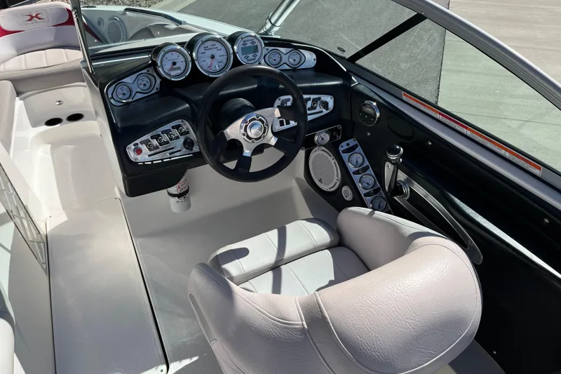 Slide: The Image of 2007 MasterCraft X-15 boat cockpit with steering wheel and instrument panel. - 10