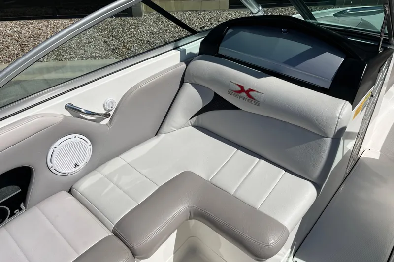 Slide: The Image of 2007 MasterCraft X-15 boat interior with white and gray seating, featuring X Series logo. - 11