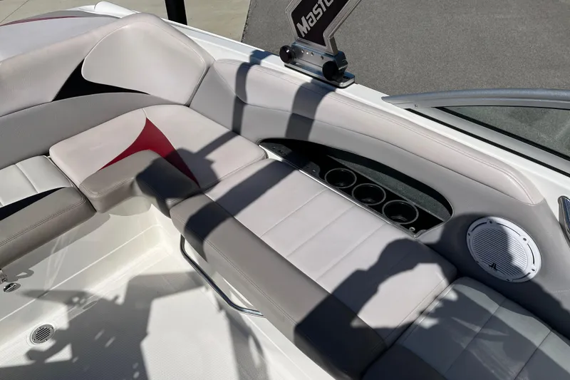 Slide: The Image of Interior of a 2007 MasterCraft X-15 boat with cushioned seating and speaker. - 14