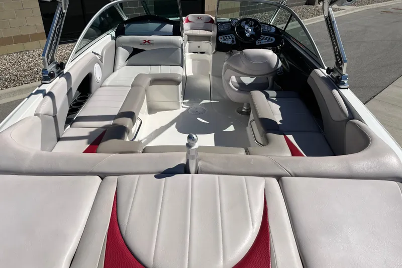 Slide: The Image of 2007 MasterCraft X-15 boat interior with beige seating and modern dashboard. - 9