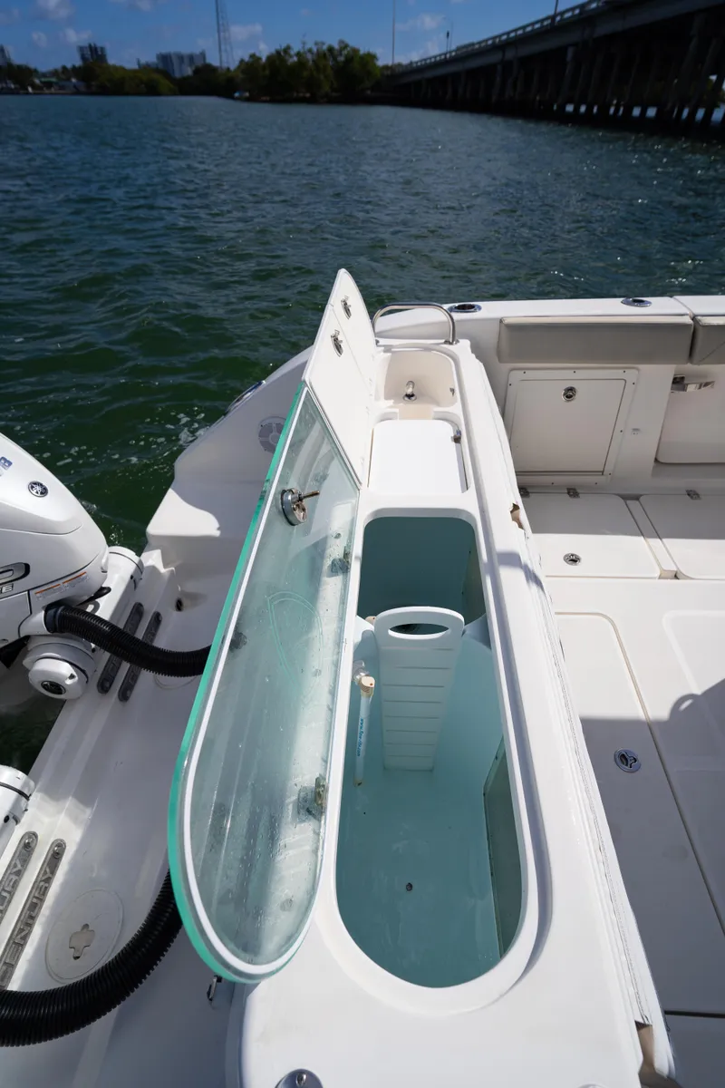 Slide: The Image of 2019 Century 3200 Center Console boat with open storage compartment on deck. - 10