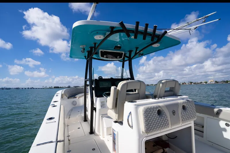 Slide: The Image of 2019 Century 3200 Center Console boat on water under blue sky. - 16