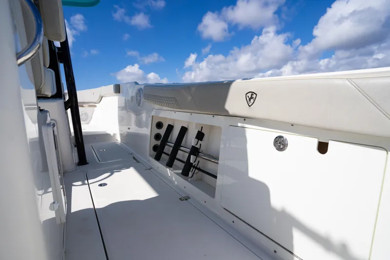 Slide: The Image of 2019 Century 3200 Center Console boat deck under a bright blue sky. - 22