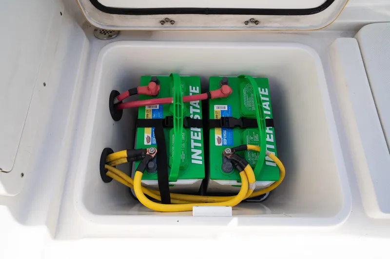 Slide: The Image of Two Interstate batteries in a 2019 Century 3200 Center Console boat compartment. - 24