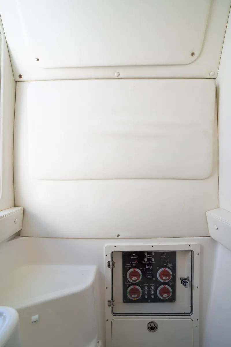 Slide: The Image of 2019 Century 3200 Center Console interior with control panel and white upholstery. - 27