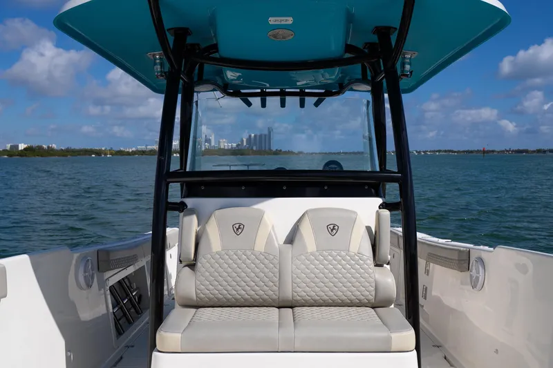 Slide: The Image of 2019 Century 3200 Center Console boat interior with cushioned seating, ocean view. - 28