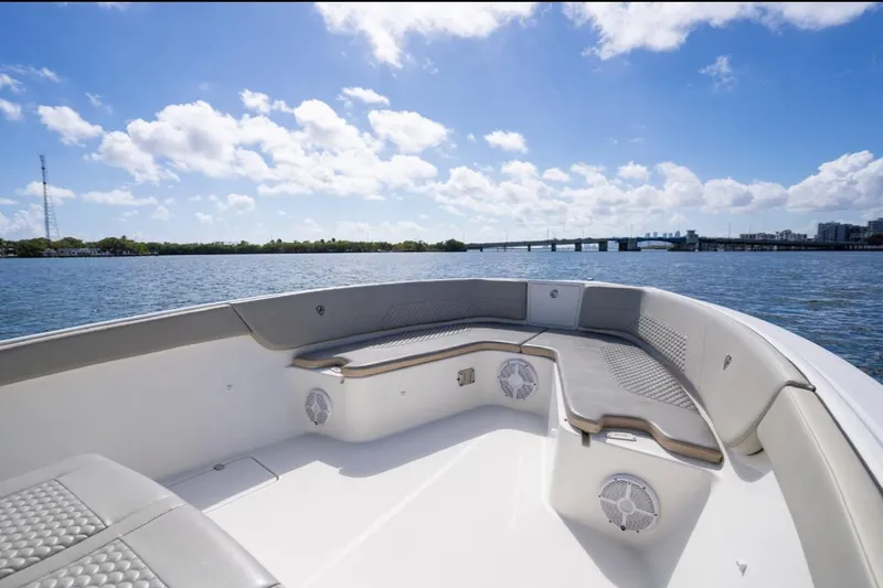 Slide: The Image of 2019 Century 3200 Center Console boat on water, clear sky, bridge in background. - 31