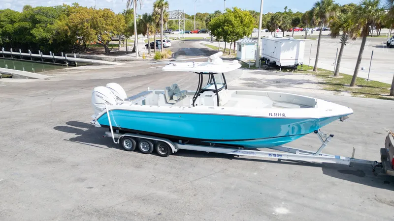 Slide: The Image of 2019 Century 3200 Center Console boat on trailer in sunny parking lot. - 36