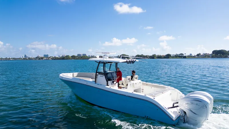 Slide: The Image of 2019 Century 3200 Center Console boat cruising on a sunny day. - 4
