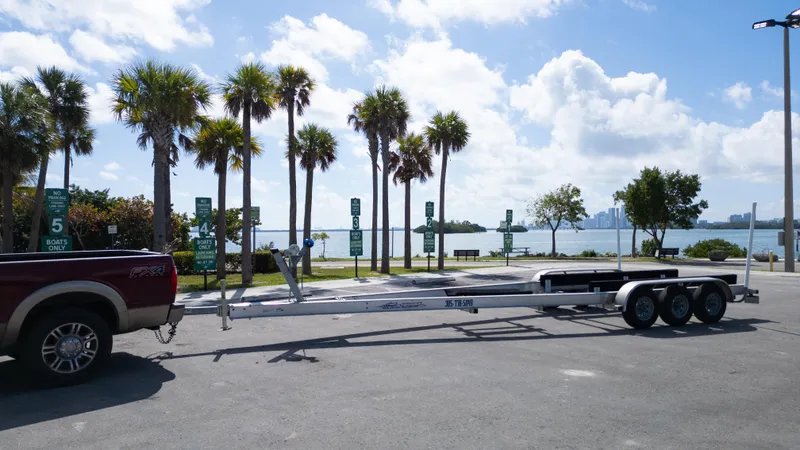 Slide: The Image of Trailer for 2019 Century 3200 Center Console by waterfront with palm trees and city skyline. - 40