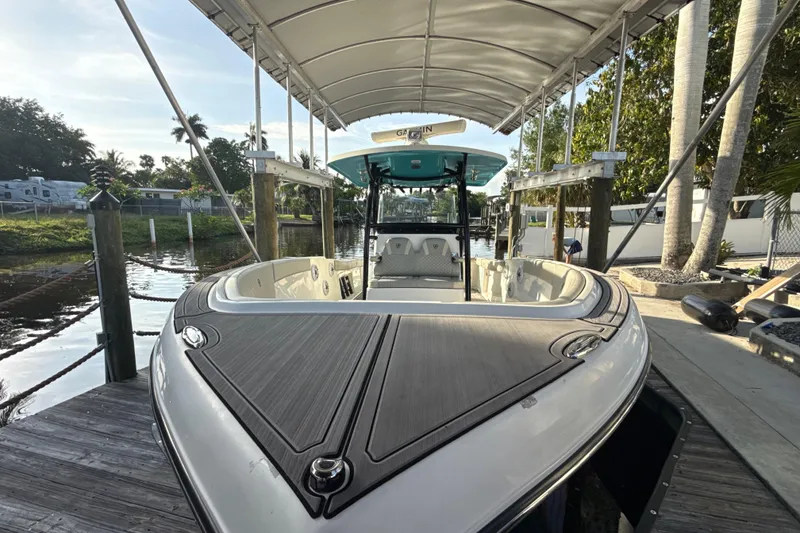 Slide: The Image of 2019 Century 3200 Center Console boat docked under canopy. - 47