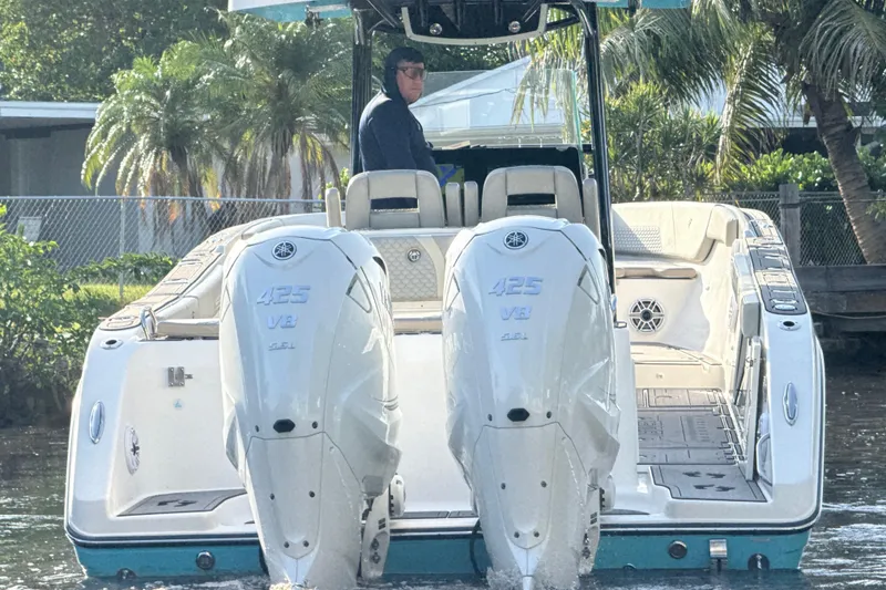 Slide: The Image of 2019 Century 3200 Center Console boat with twin Yamaha 425 V8 engines on water. - 49