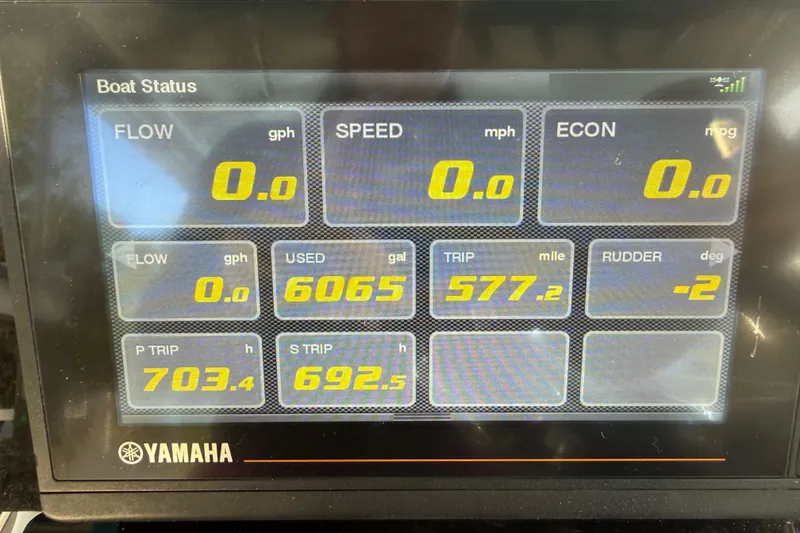 Slide: The Image of Dashboard display of a 2019 Century 3200 Center Console boat showing fuel and trip data. - 57