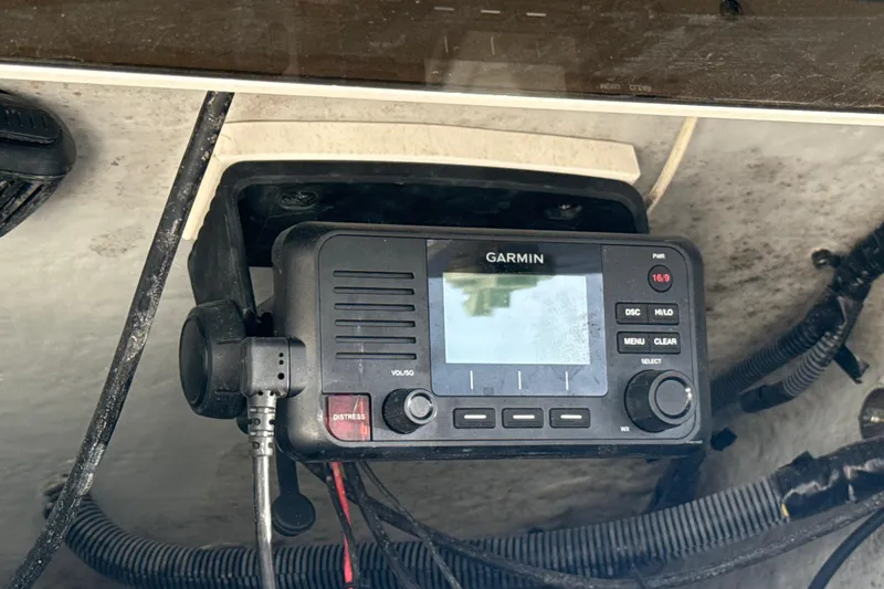 Slide: The Image of Garmin marine radio installed on a 2019 Century 3200 Center Console boat. - 59