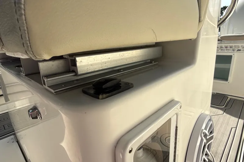 Slide: The Image of Close-up of 2019 Century 3200 Center Console boat interior, featuring seating and control panel. - 61