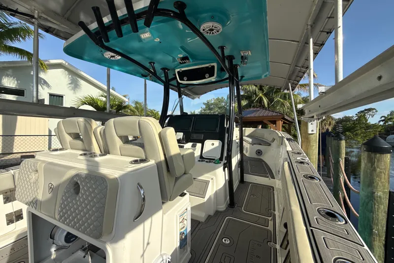 Slide: The Image of 2019 Century 3200 Center Console boat with modern seating and advanced navigation equipment. - 62