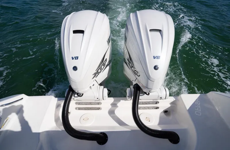 Slide: The Image of Twin V8 outboard engines on a 2019 Century 3200 Center Console boat. - 8