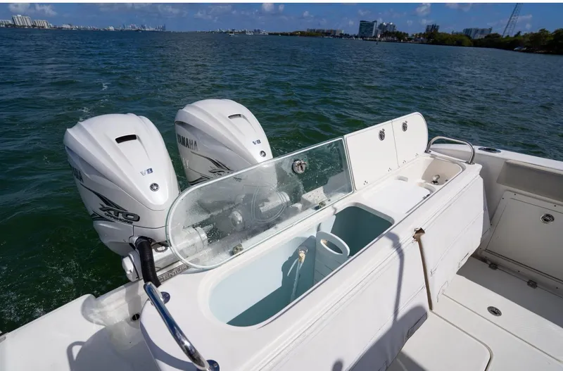 Slide: The Image of 2019 Century 3200 Center Console boat with twin Yamaha engines on open water. - 9