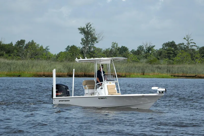 Slide: The Image of 2018 Sportsman Tournament 214 Bay Boat cruising on a scenic river. - 3