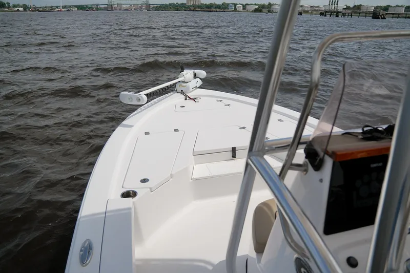 Slide: The Image of 2018 Sportsman Tournament 214 Bay Boat on water, showcasing bow and console. - 6