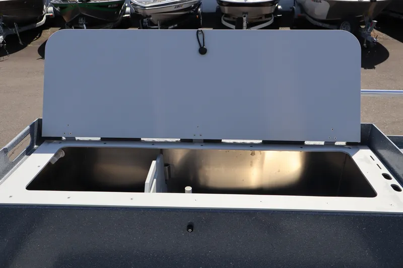 Slide: The Image of Open storage compartment on 2026 KingFisher 2825 Coastal Express boat. - 10