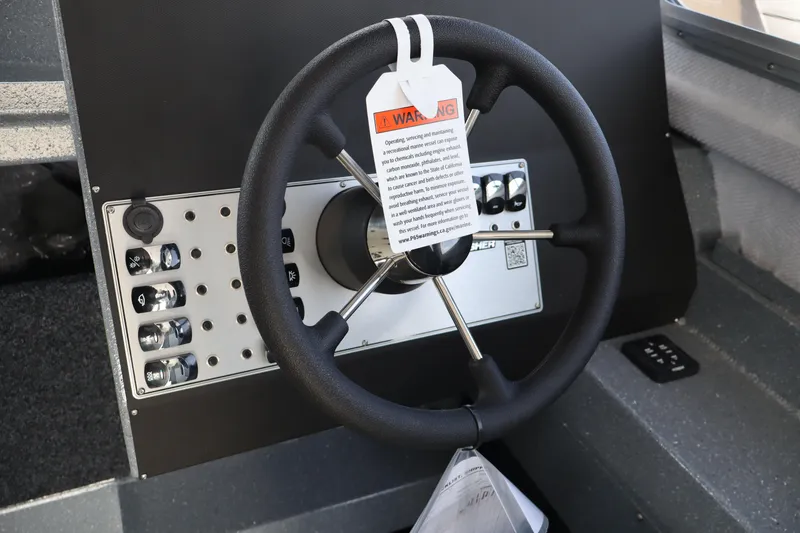 Slide: The Image of Steering wheel of 2026 KingFisher 2825 Coastal Express boat with control panel. - 26