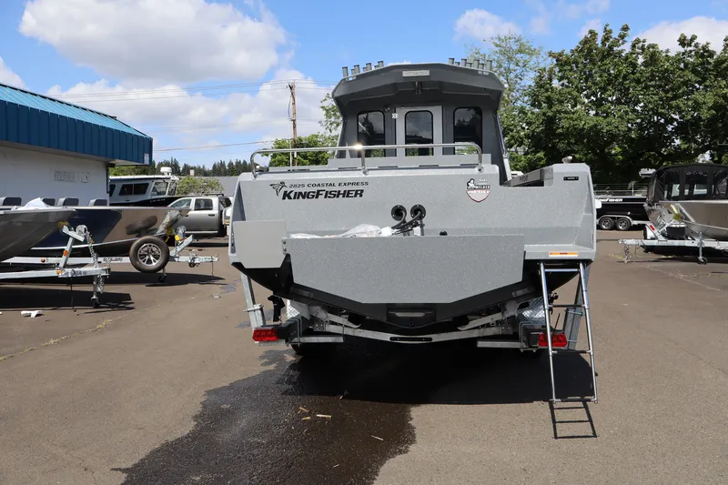 Slide: The Image of 2026 KingFisher 2825 Coastal Express boat parked outdoors on a sunny day. - 6