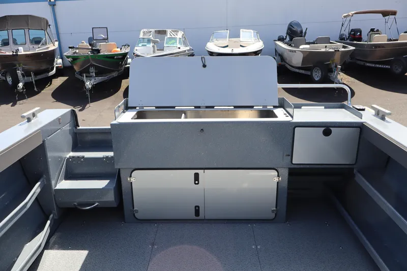 Slide: The Image of Interior view of 2026 KingFisher 2825 Coastal Express boat with storage compartments. - 8