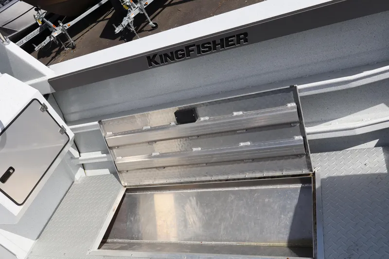 Slide: The Image of Interior view of 2026 KingFisher 2425 Escape HT boat with storage compartment open. - 17