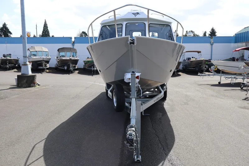 Slide: The Image of 2026 KingFisher 2425 Escape HT boat on trailer in dealership lot. - 2