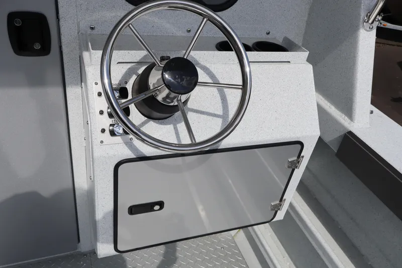 Slide: The Image of Steering wheel of 2026 KingFisher 2425 Escape HT boat, featuring sleek design and controls. - 20