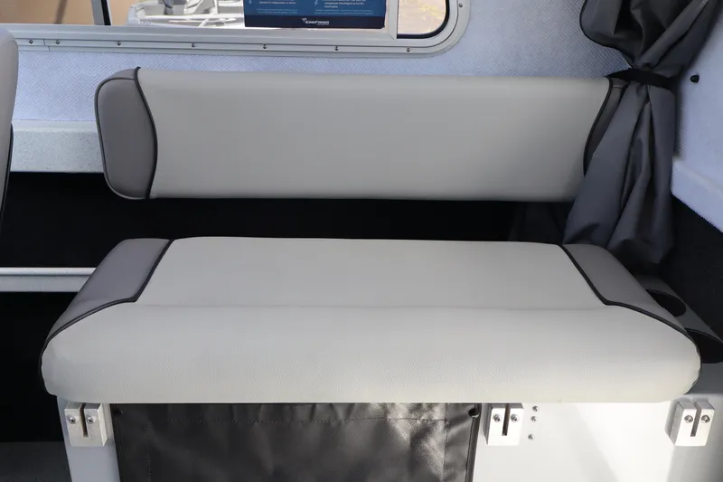 Slide: The Image of Interior seating of 2026 KingFisher 2425 Escape HT boat, featuring cushioned bench design. - 23