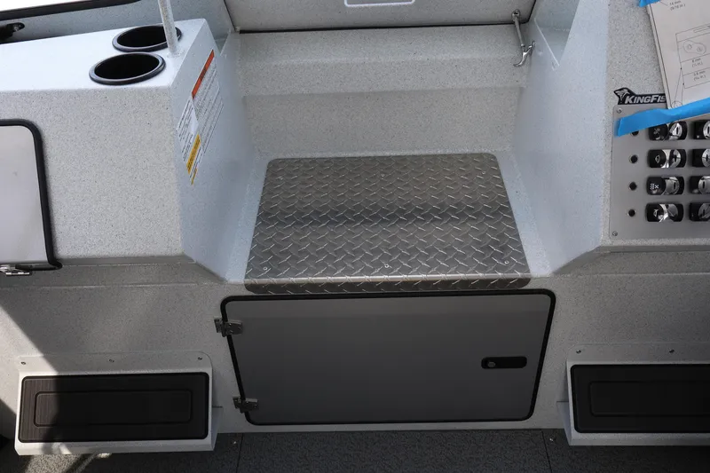 Slide: The Image of Interior of 2026 KingFisher 2425 Escape HT boat with cup holders and control panel. - 28