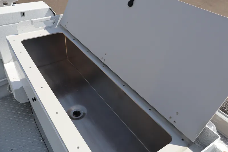 Slide: The Image of Open storage compartment on 2026 KingFisher 2425 Escape HT boat. - 9
