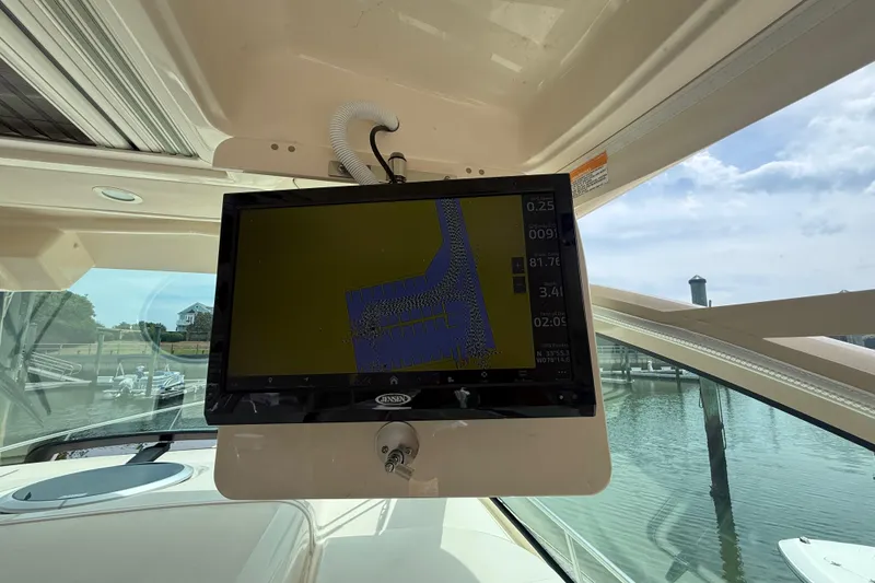 Slide: The Image of Interior view of a 2021 Grady-White Express 370 boat with navigation display. - 18