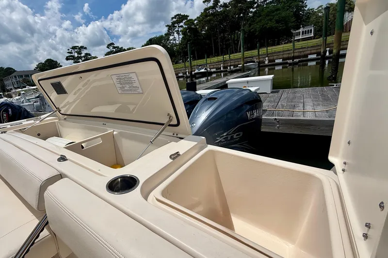 Slide: The Image of 2021 Grady-White Express 370 boat with open storage compartment and Yamaha XTO engine. - 21