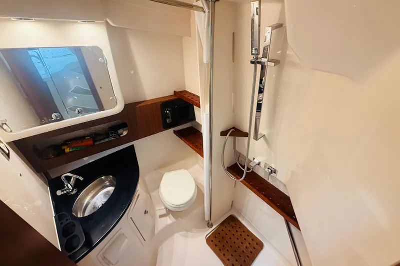 Slide: The Image of Luxurious bathroom in 2021 Grady-White Express 370 boat, featuring modern fixtures and elegant design. - 27