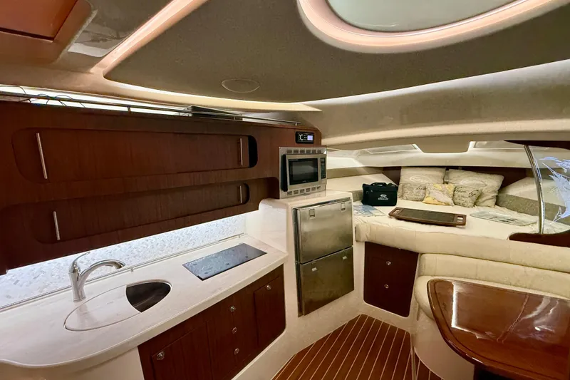 Slide: The Image of Luxurious interior of 2021 Grady-White Express 370 yacht with kitchenette and seating area. - 29