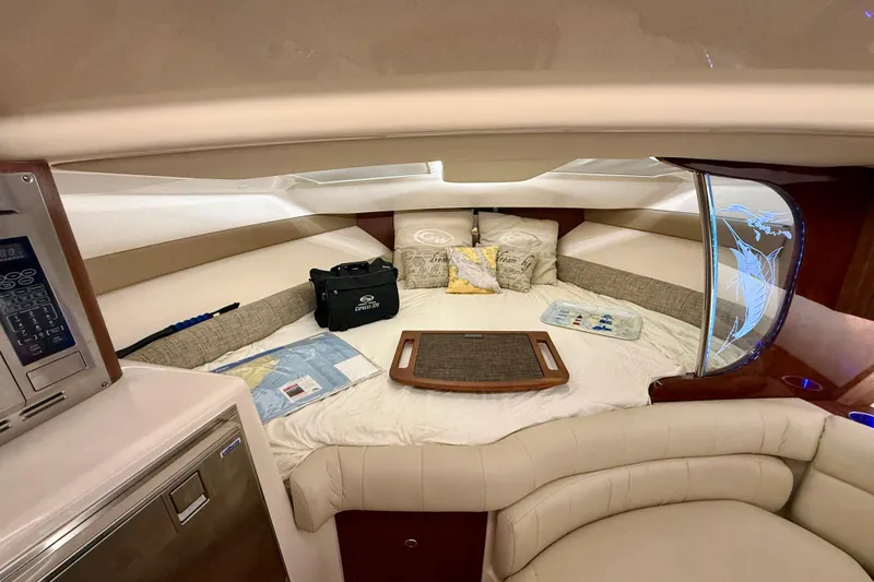 Slide: The Image of Luxurious cabin interior of 2021 Grady-White Express 370 boat with cozy bedding and decor. - 30