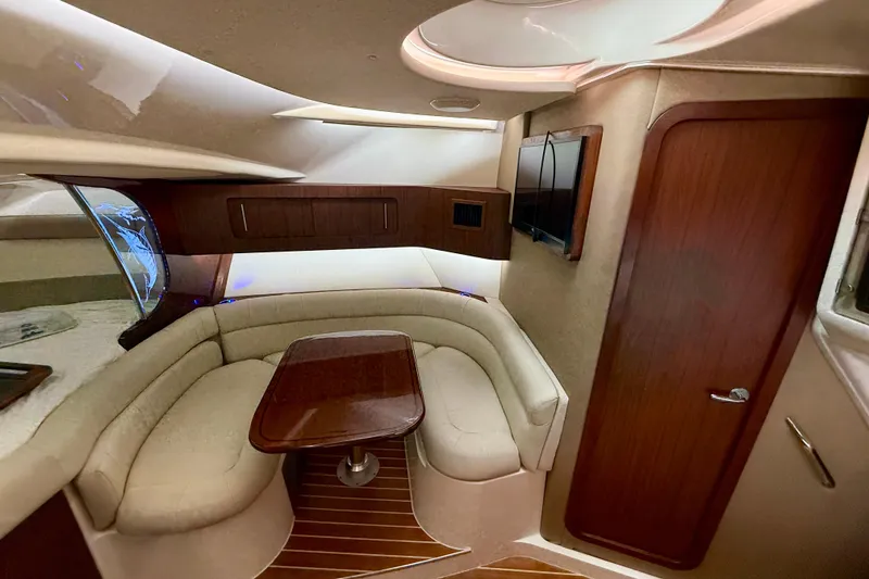 Slide: The Image of Luxurious interior of 2021 Grady-White Express 370 boat with plush seating and wooden accents. - 31