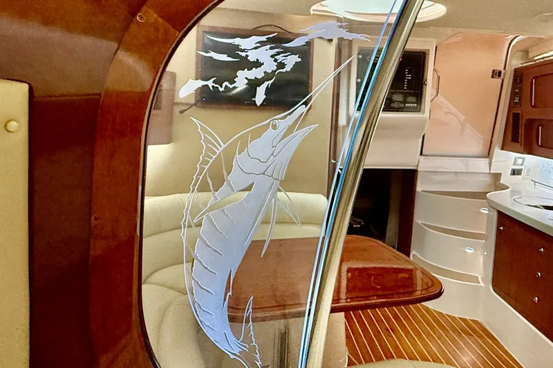Slide: The Image of Interior of 2021 Grady-White Express 370 with marlin design on glass partition. - 32