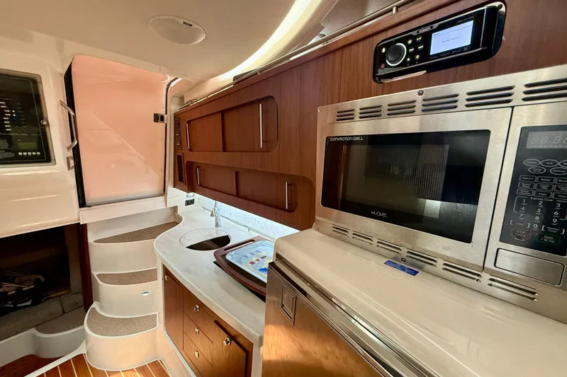 Slide: The Image of Interior of 2021 Grady-White Express 370 boat with modern kitchen amenities. - 36