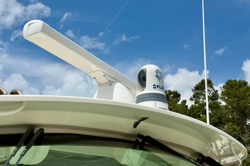 Slide: The Image of Radar and FLIR camera on 2021 Grady-White Express 370 boat under blue sky. - 37