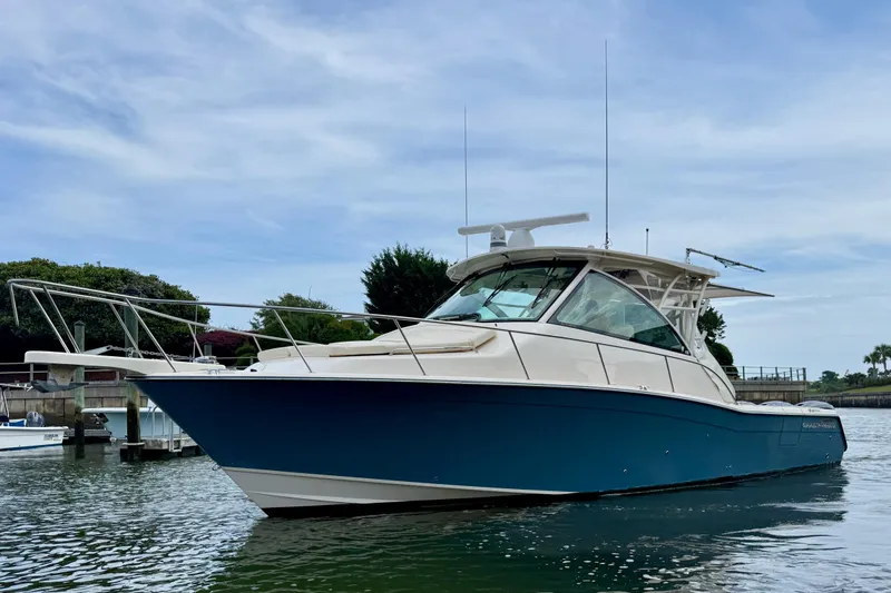 Slide: The Image of 2021 Grady-White Express 370 boat on water, featuring sleek design and modern amenities. - 4