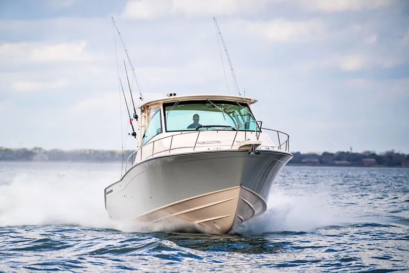 Slide: The Image of Manufacturer Provided Image: 2021 Grady-White Express 370 boat cruising on open water. - 43
